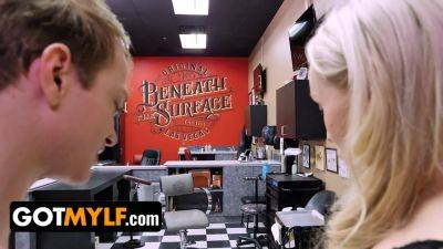 Watch this hot MILF with perfect ass distract young stud with passionate blowjob in tattoo studio - sexu.com
